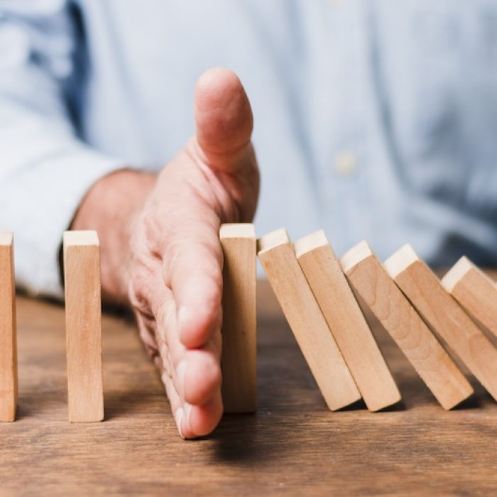 businessman-using-wooden-pieces
